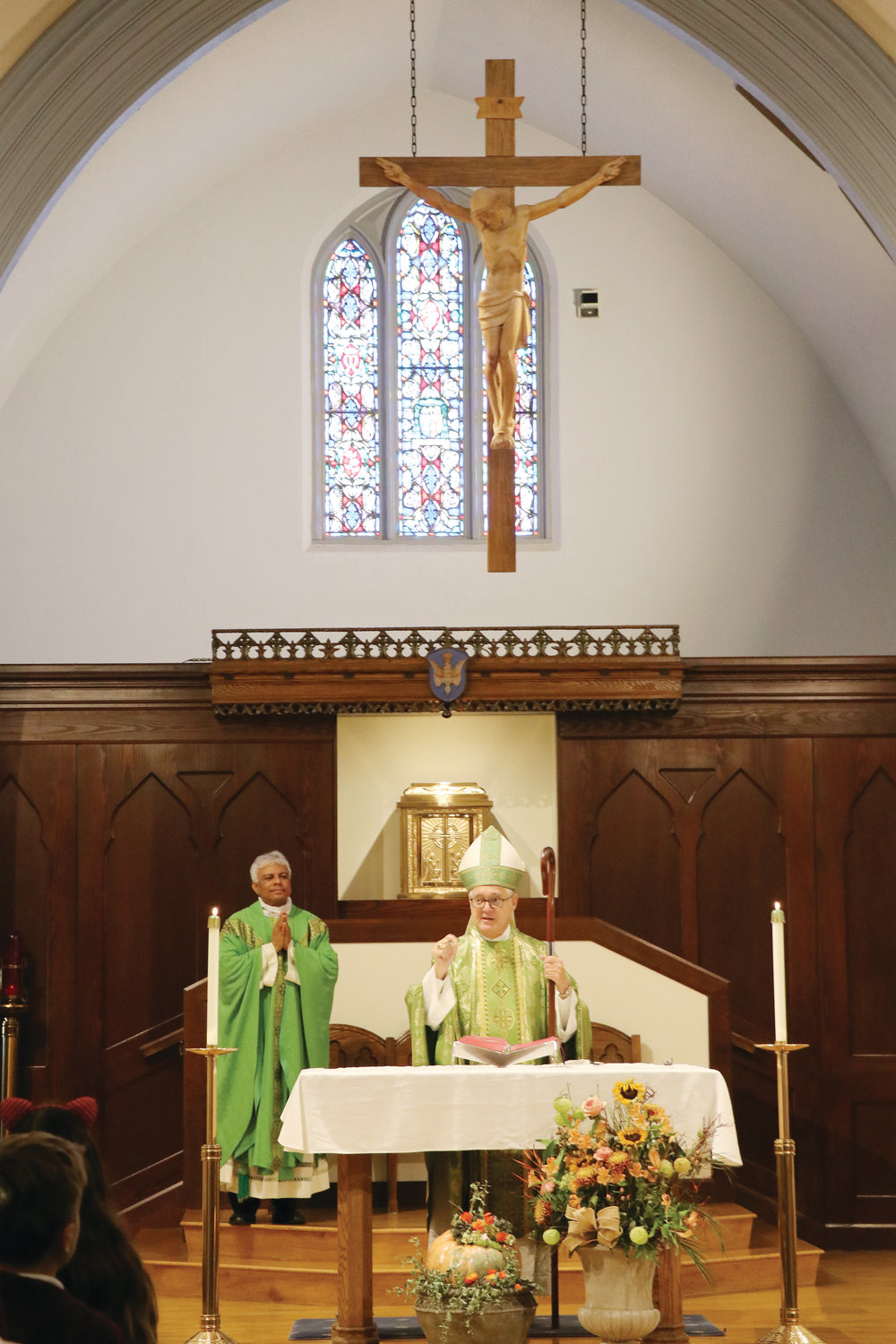 Father TJ Varghese concelebrates Mass with Bishop Tobin.